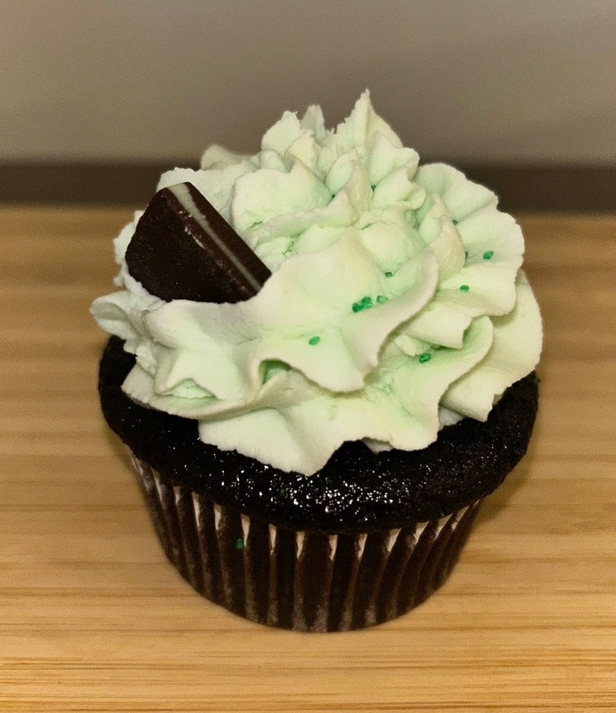 Buttercream frosting swirl piped on cupcake